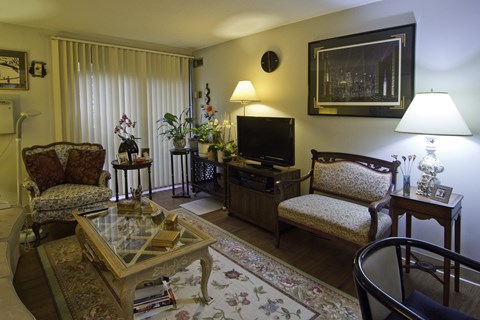 a living room filled with furniture and a television